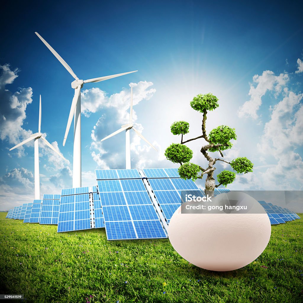 sustainable energy and nature reborn concept sustainable energy windmill,solar power panel and tree born from egg Blue Stock Photo