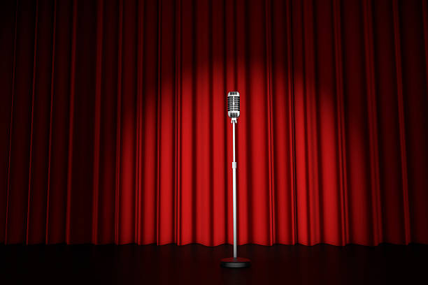 Theatre curtain and microphone in a spotlight