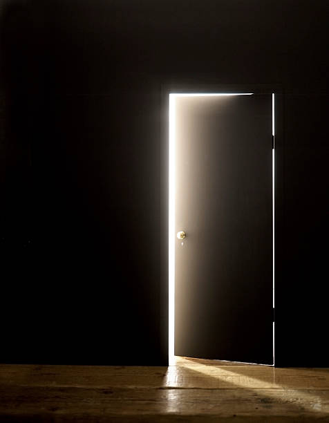 istock DARKENED ROOM DOOR OPENING WITH FLARE 529541997