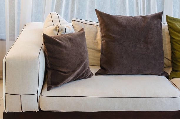 istock brown pillow on white sofa in living room 529542289