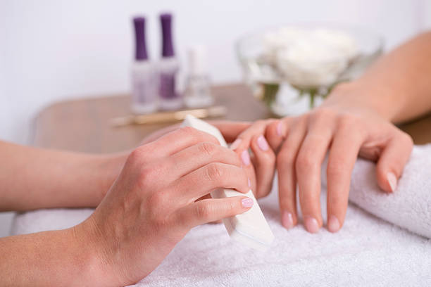 istock client and manicurist in manicure salon 529544429