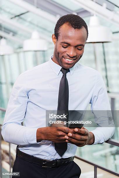 Typing Business Message Stock Photo - Download Image Now - Adult, Adults Only, African Ethnicity