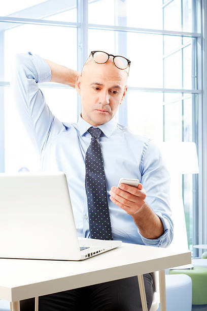 istock Businessman with mobile phone 529554873