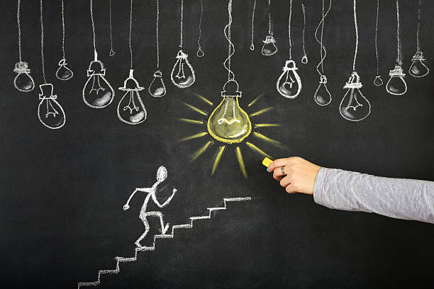 istock Stick Figure Climbing Ladder To Success 529555089