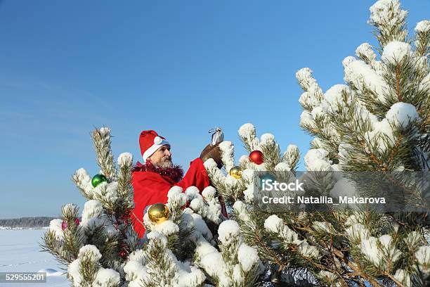 The Man In Santa Clauss Suit Stock Photo - Download Image Now - Active Lifestyle, Active Seniors, Activity