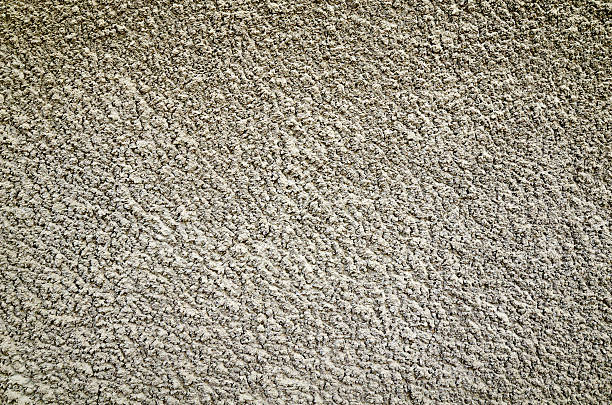 コンクリートの壁のブラウンの背景 - stucco wall textured textured effect ストックフォトと画像