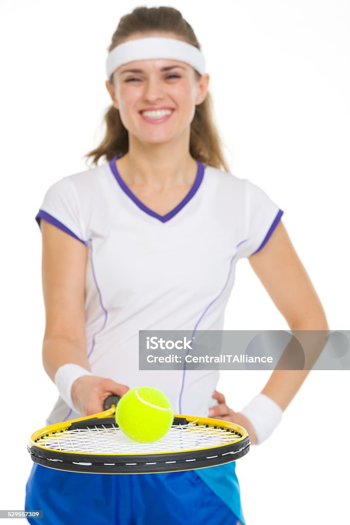 Tennis player balancing ball on racket. Closeup Closeup on tennis player balancing ball on racket Active Lifestyle Stock Photo