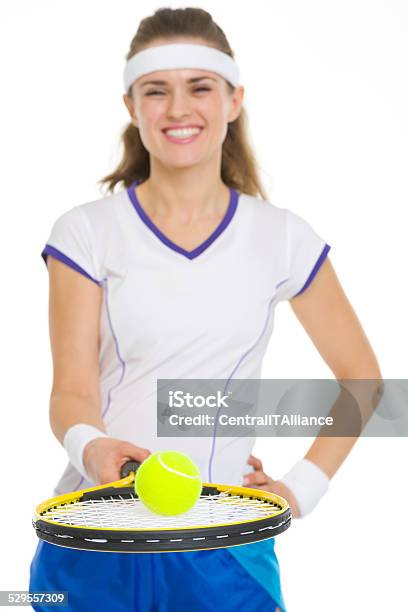 Tennis Player Balancing Ball On Racket Closeup Stock Photo - Download Image Now - Active Lifestyle, Adult, Balance