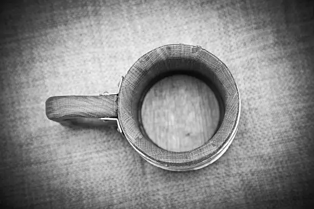Wooden mug, top view. Black and white photo