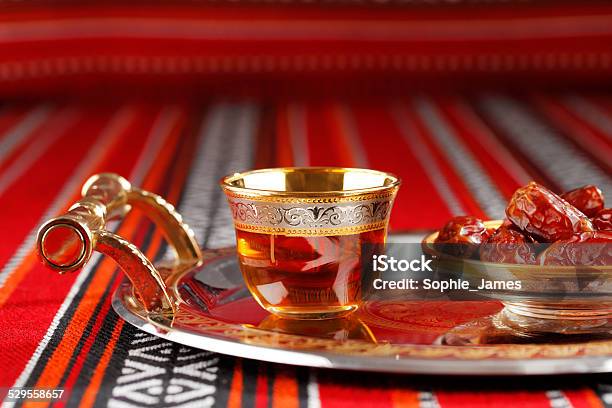 Iconic Abrian Fabric With Arabic Tea And Dates Stock Photo - Download Image Now - Iftar, Tea - Hot Drink, Ancient