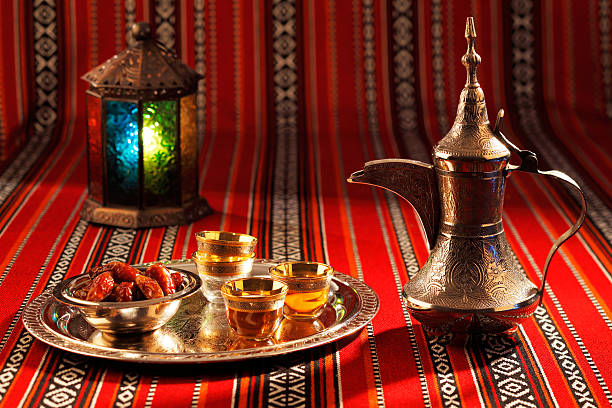 Iconic Abrian fabric with Arabic tea and dates Iconic Abrian fabric is graced with symbols of Arabia, in particular Arabic tea and dates, they symbolise Arabian hospitality. bedouin stock pictures, royalty-free photos & images