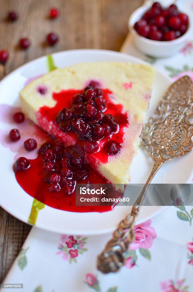 Baked cottage cheese pudding with cranberries Baked cottage cheese pudding with cranberries and beautiful vintage cake server on the table Antique Stock Photo