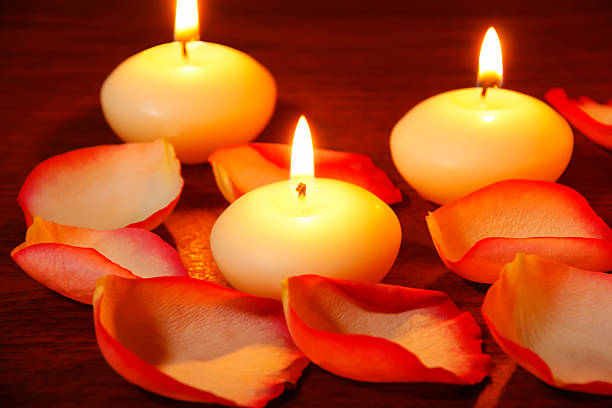 istock Petals of roses and candles 529573327