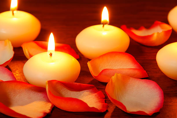 istock Petals of roses and candles 529573333
