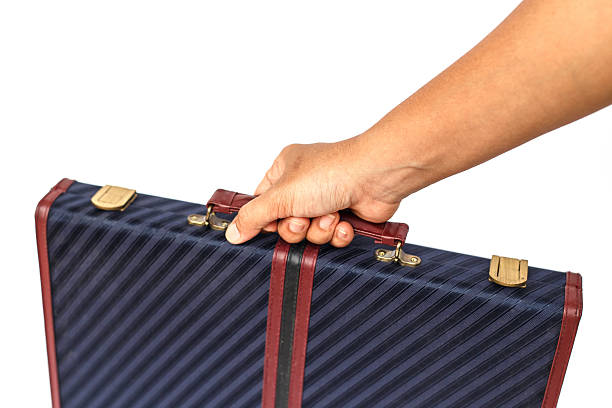 istock Hand holding Briefcase Isolated on White Background 529573581