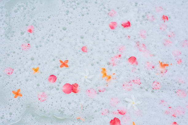istock flower and soap foam in bathtub 529573781