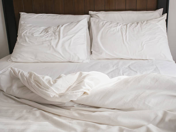 istock Bed and pillows messed up in the morning 529576307