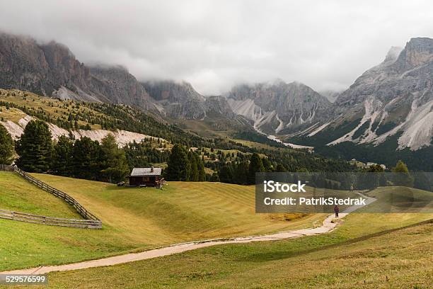 Walker On Track In Dolomites Stock Photo - Download Image Now - Alto Adige - Italy, Cliff, Curve