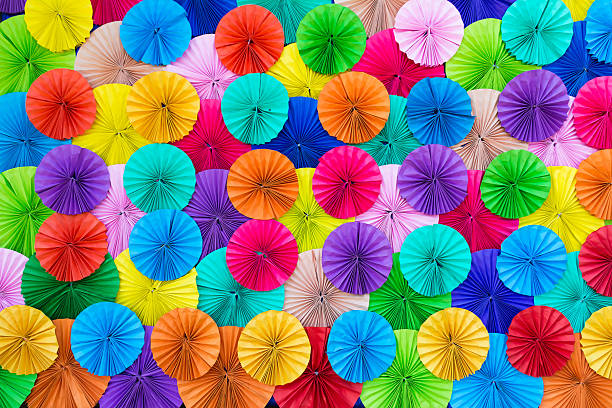 istock Colored paper, folded in a circle Ornamental decorated backgroun 529578907