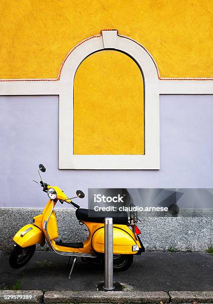 Classic Scooter Against Grunge Wall Color Image Stock Photo - Download Image Now - Milan, Yellow, Moped