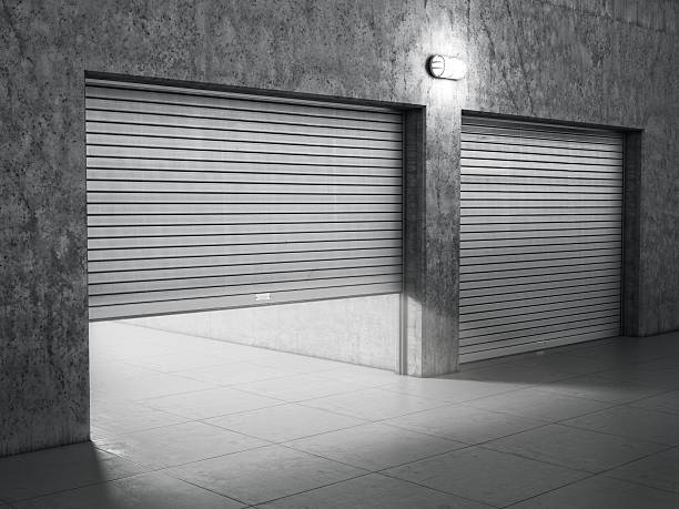 istock Garage building made of concrete with roller shutter doors 529580269