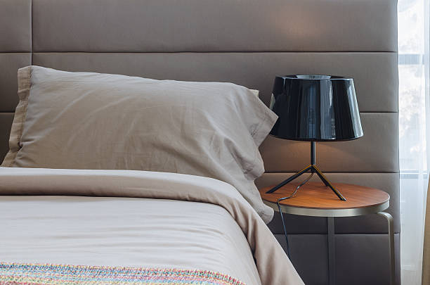 istock modern bedroom with black lamp on wood table 529586417