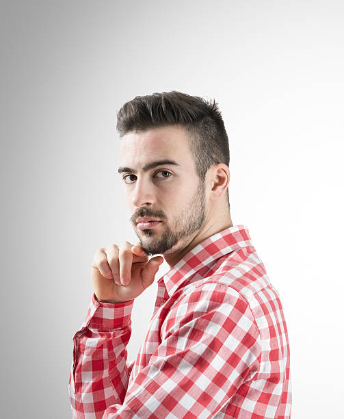 istock Portrait of confident young bearded man looking at camera 529587801