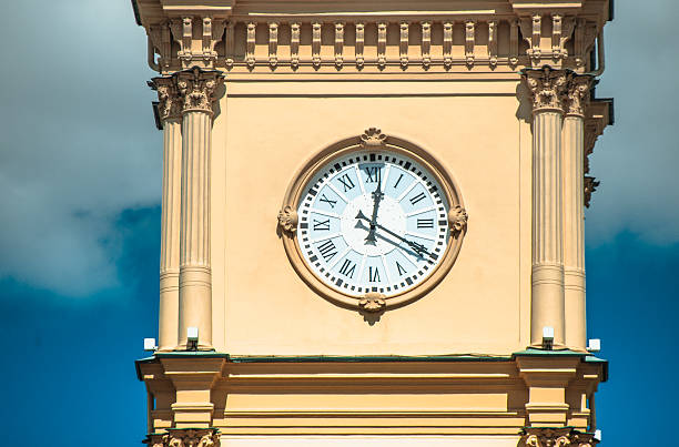 istock Yellow clock tower against the blue sky 529589589