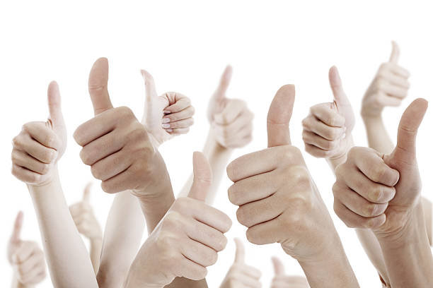 istock Many people holding their thumbs up 529589893