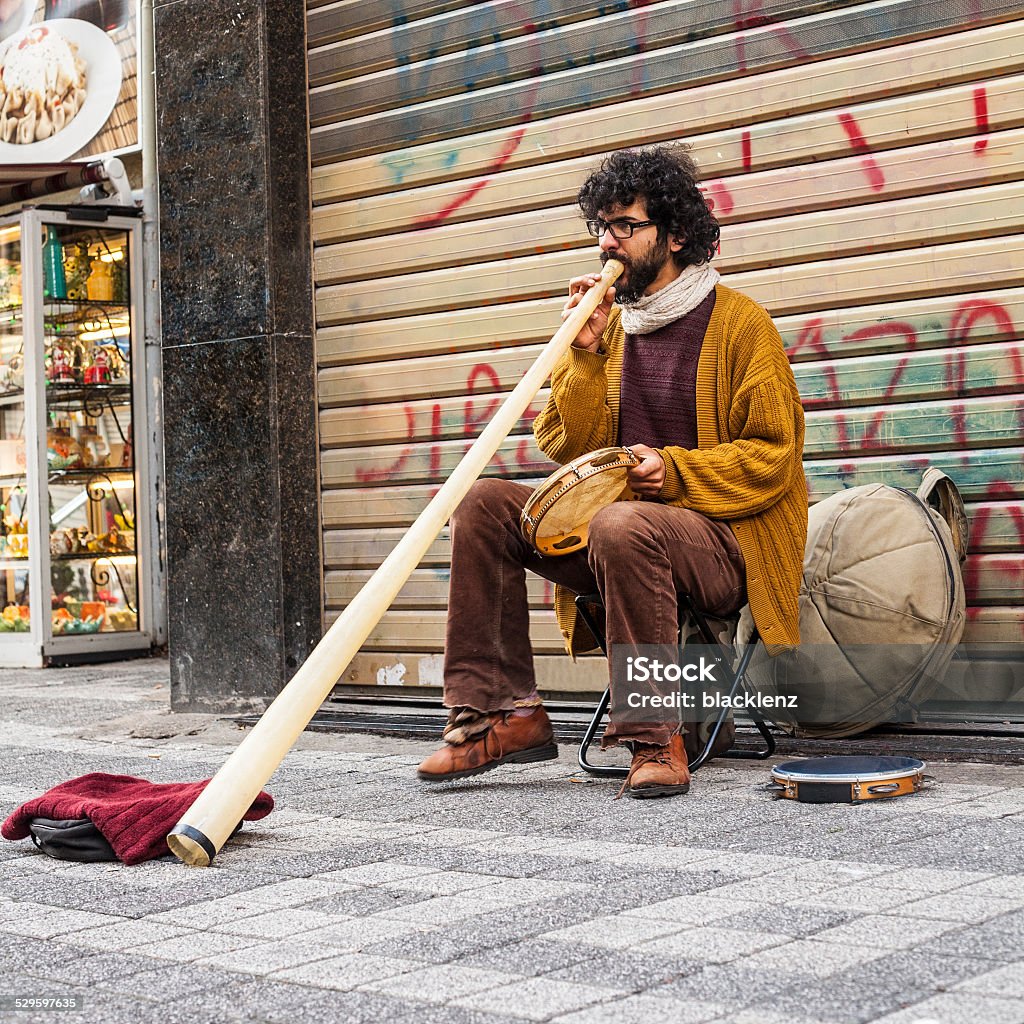 Brazilian street musician in turkey plays caribbean drum and didgeridoo Street Musician Stock Photo