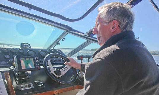 Rudder and controls of the yacht close-up.Steering wheel on yacht