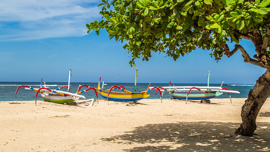 beach in bali, three boats ready to sail, sanur