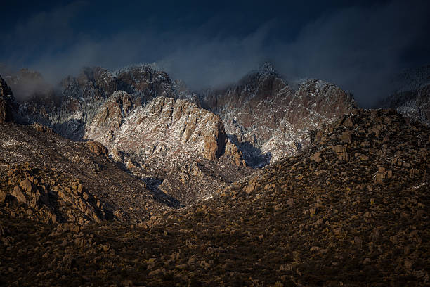 прочный зимние горы - moody sky dark saturated color extreme terrain стоковые фото и изображения