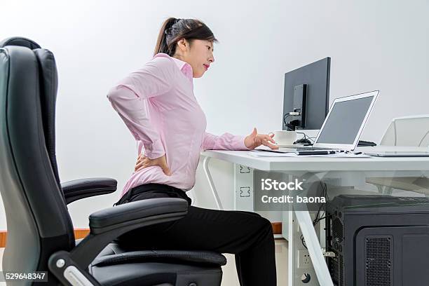 Businesswoman Backache Stock Photo - Download Image Now - Backache, Laptop, 30-39 Years