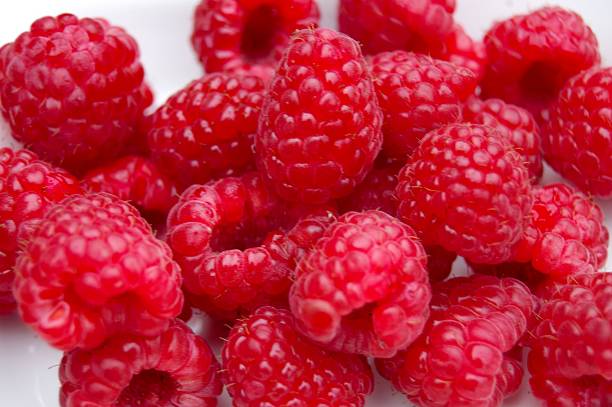 istock Raspberries in White Background-Yummy! 529648371