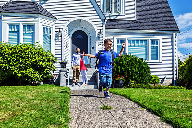 istock Young Boy Running Off To School 529649233