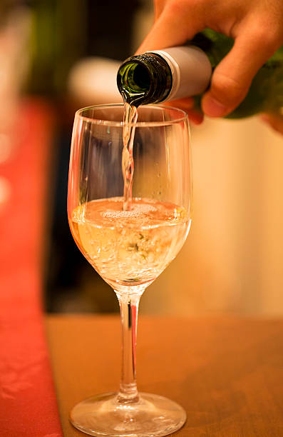 istock Pouring Glass of White Wine 529649473