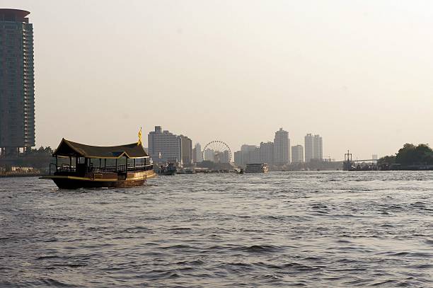 istock Traditional barge on Chao Phraya river in Bangkok 529649753