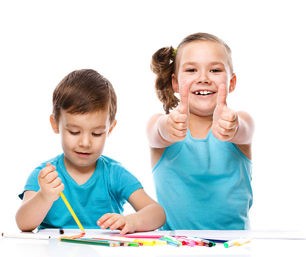istock Cute children is drawing on white paper 529651541