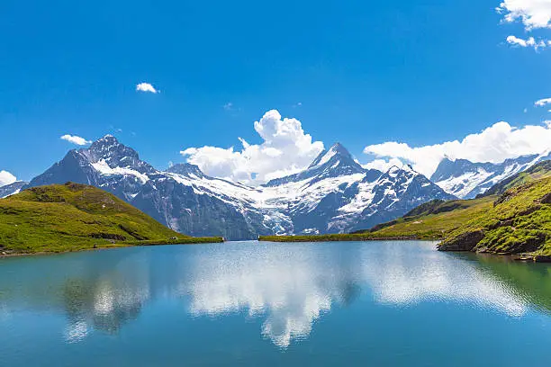 Panorama view of Bachalpsee and the snow peaks with glacier of swiss alps