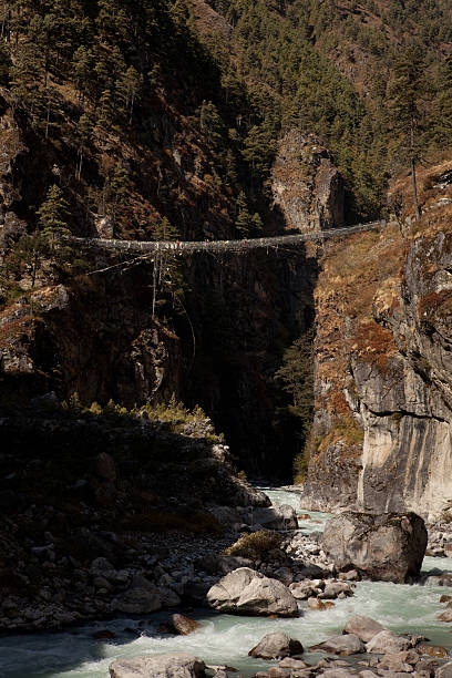 istock Larja pedestrian suspension bridge in Nepal. 529652365