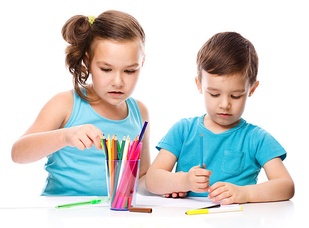 istock Little children is drawing on white paper 529652651