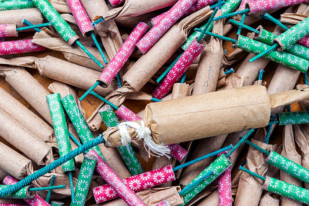 Firecrackers Aerial view of a messy pile of different types of firecrackers. firework explosive material photos stock pictures, royalty-free photos & images