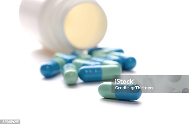 Pills In Pill Bottle On White Background Stock Photo - Download Image Now - Acetylsalicylic Acid, Addiction, Antibiotic