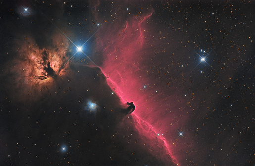 Flame (NGC 2024) and Horsehead (Barnard 33) nebula and beautifull emission courtains behind it (IC434) in Orion constellation. Picture taken with professional CCD camera and reflector (newtonian) telescope (750mm, f/5) ha-alpha wavelength mixed with RGB.