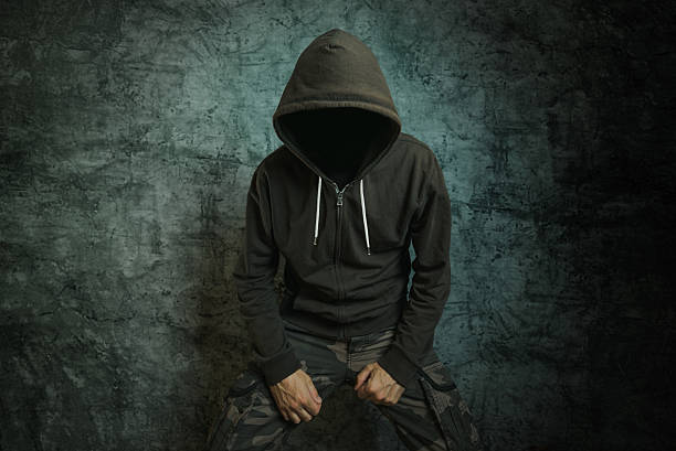 istock Spooky evil criminal person with hooded jacket 529662028