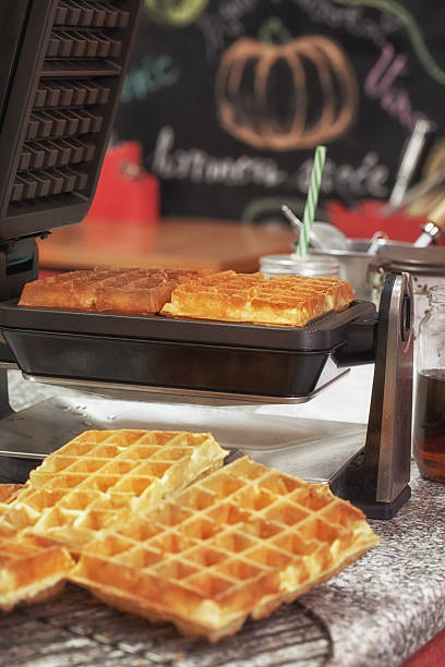 istock Preparing Homemade Waffles in Waffle Iron 529664472
