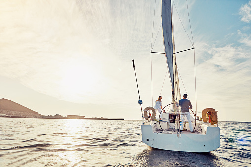 Shot of a couple out sailing on a yacht