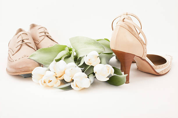 istock Couple's wedding shoes on white background 529667786