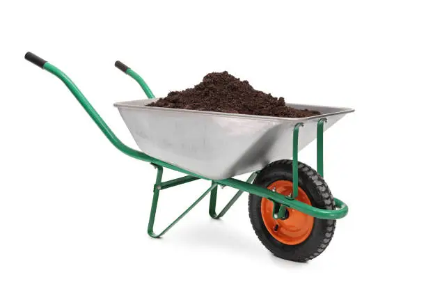 Photo of Studio shot of a wheelbarrow full of dirt